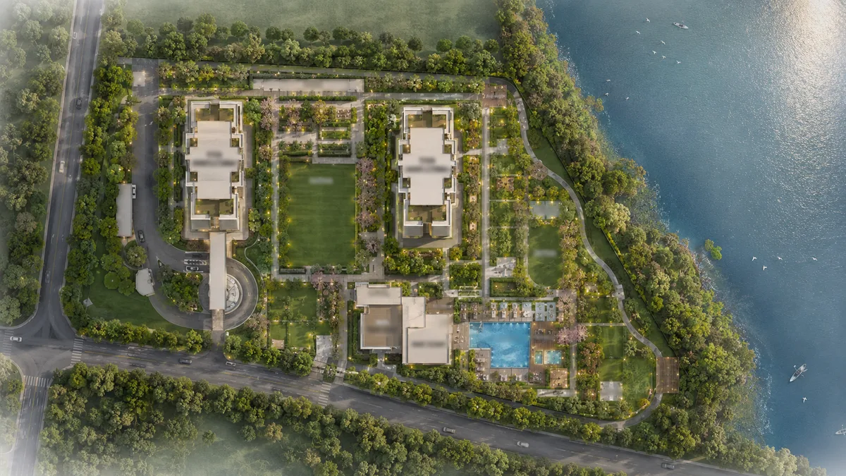 SNN Raj Azaleas master plan site layout showing the tower placement, the central amenity precinct, the swimming pool, the sports courts and the lake-adjacent open space